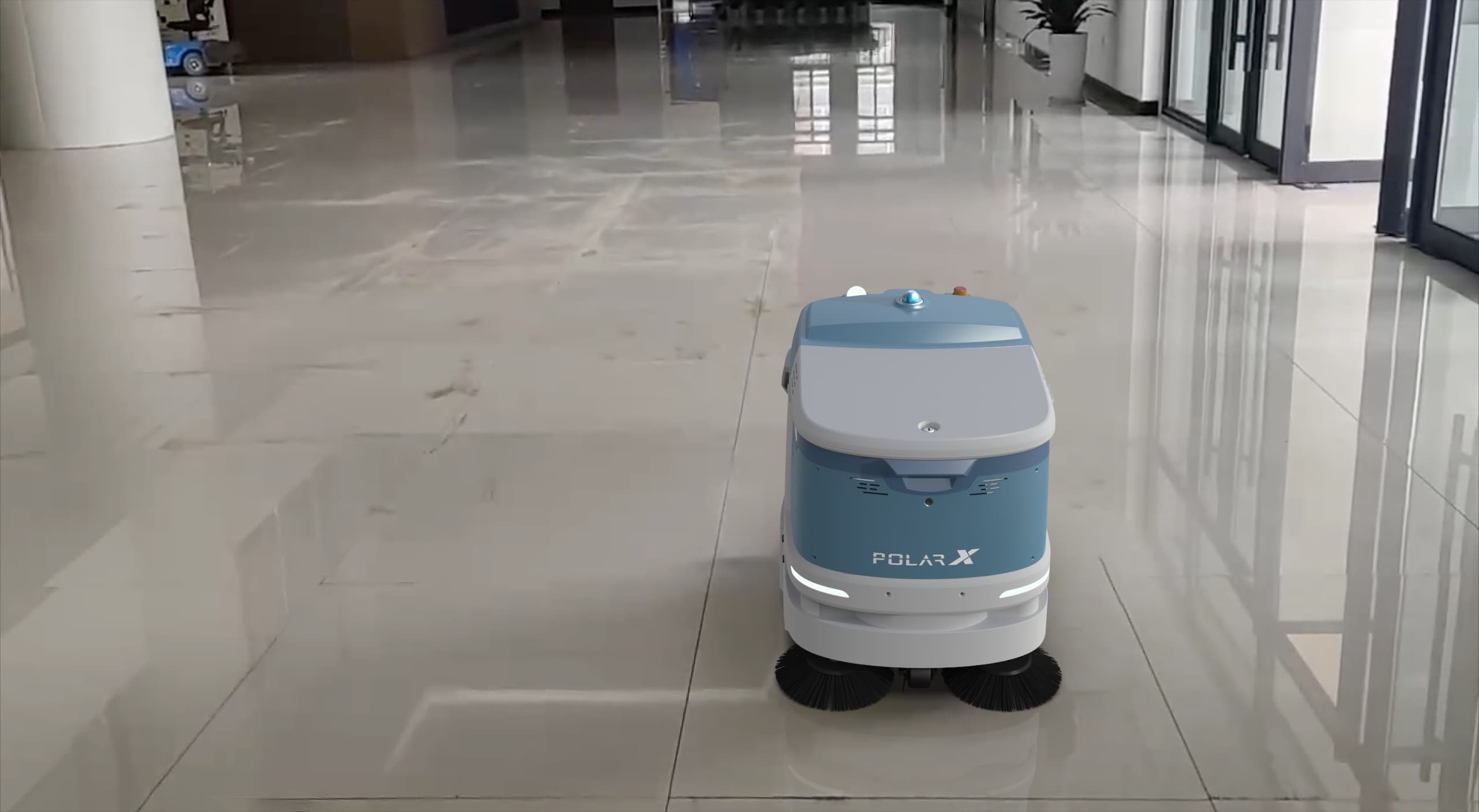 Commercial cleaning robot operating across a polished commercial building floor