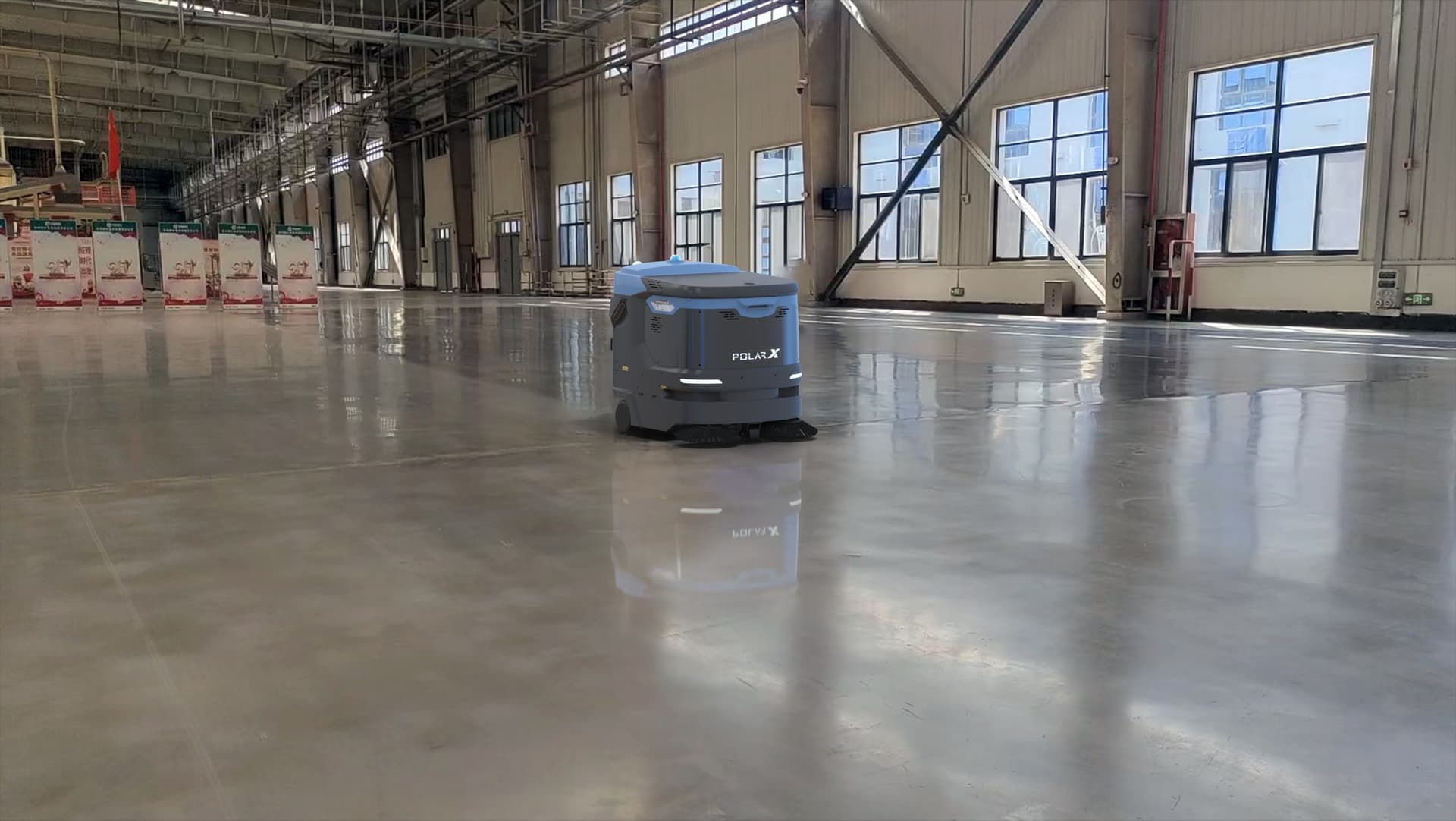 PolarX cleaning robot operating on a warehouse logistics facility floor